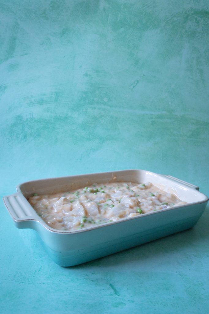fish pie ready to be topped with potato